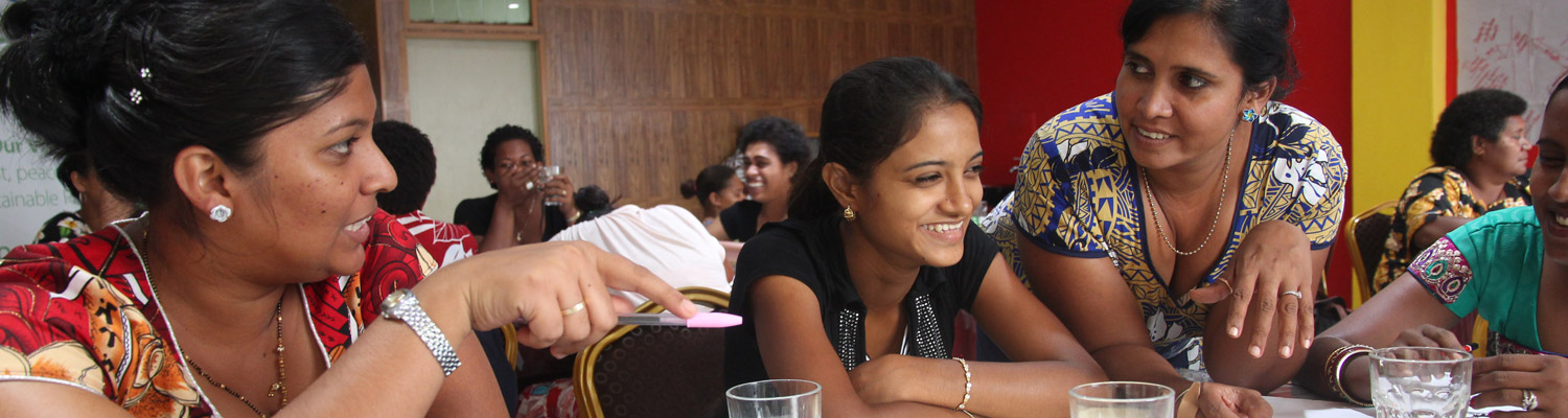 Women at a table having a discussion in Fiji Women at a table having a discussion in Fiji